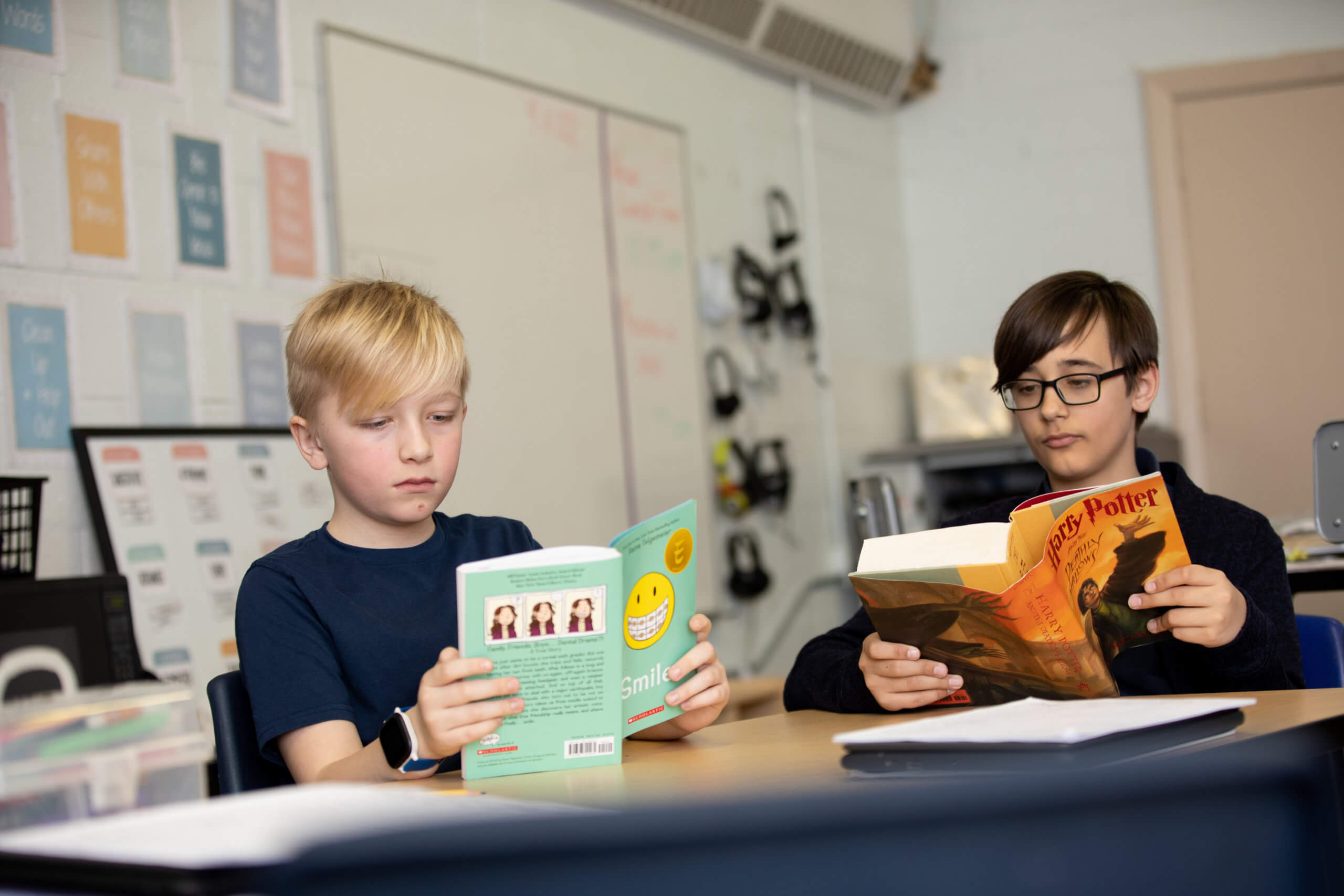 Two young MMAEC Students read through their favorite fiction in the classroom together.