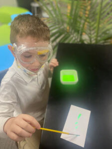 Young MMAEC Student uses neon paint in the classroom